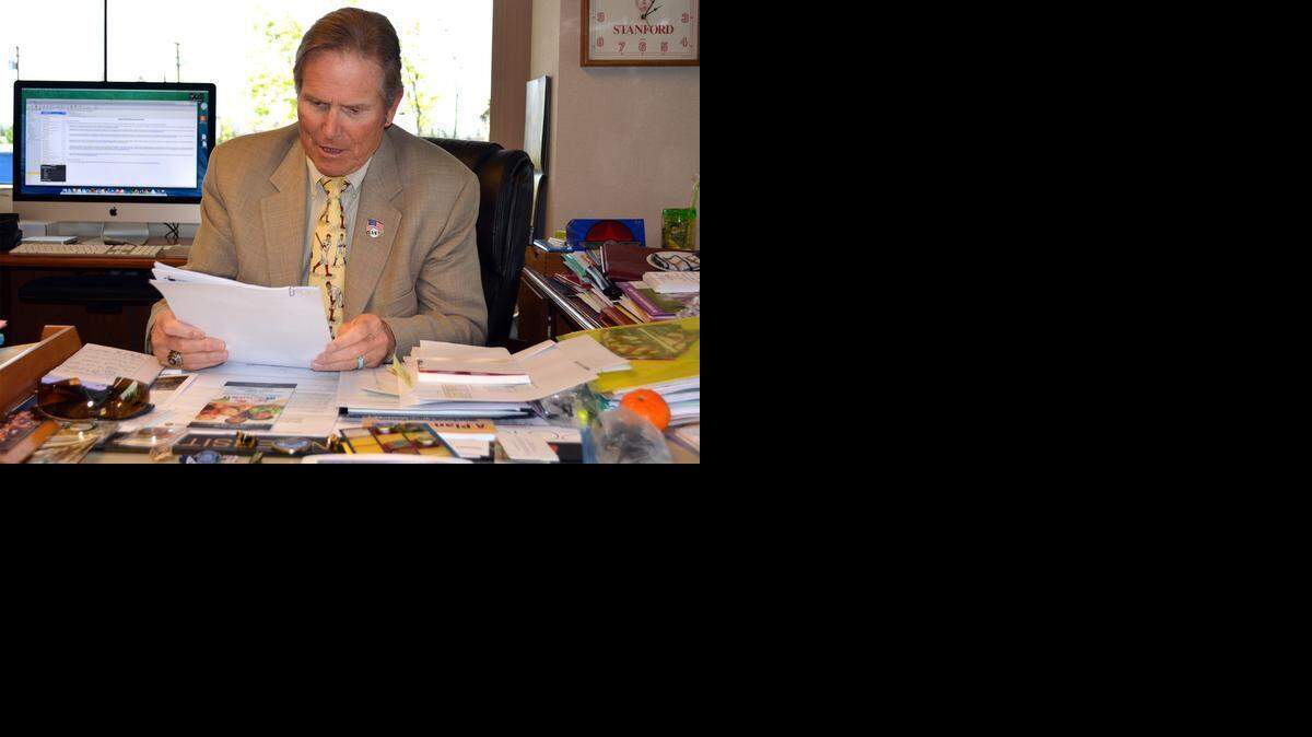 
Superintendent Tom Changnon works at his desk at the Stanislaus County Office of Education in Modesto on Friday.
