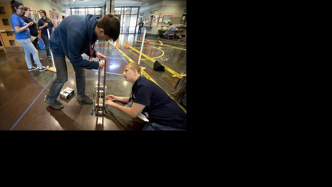 
Whitmore Charter School sophomores Jodan Hoxie, left, and Mohamad Sabri, right, prepare for the Scrambler competition during the 29th Stanislaus County Regional Science Olympiad at Modesto Junior College West Campus in Modesto on Saturday.
