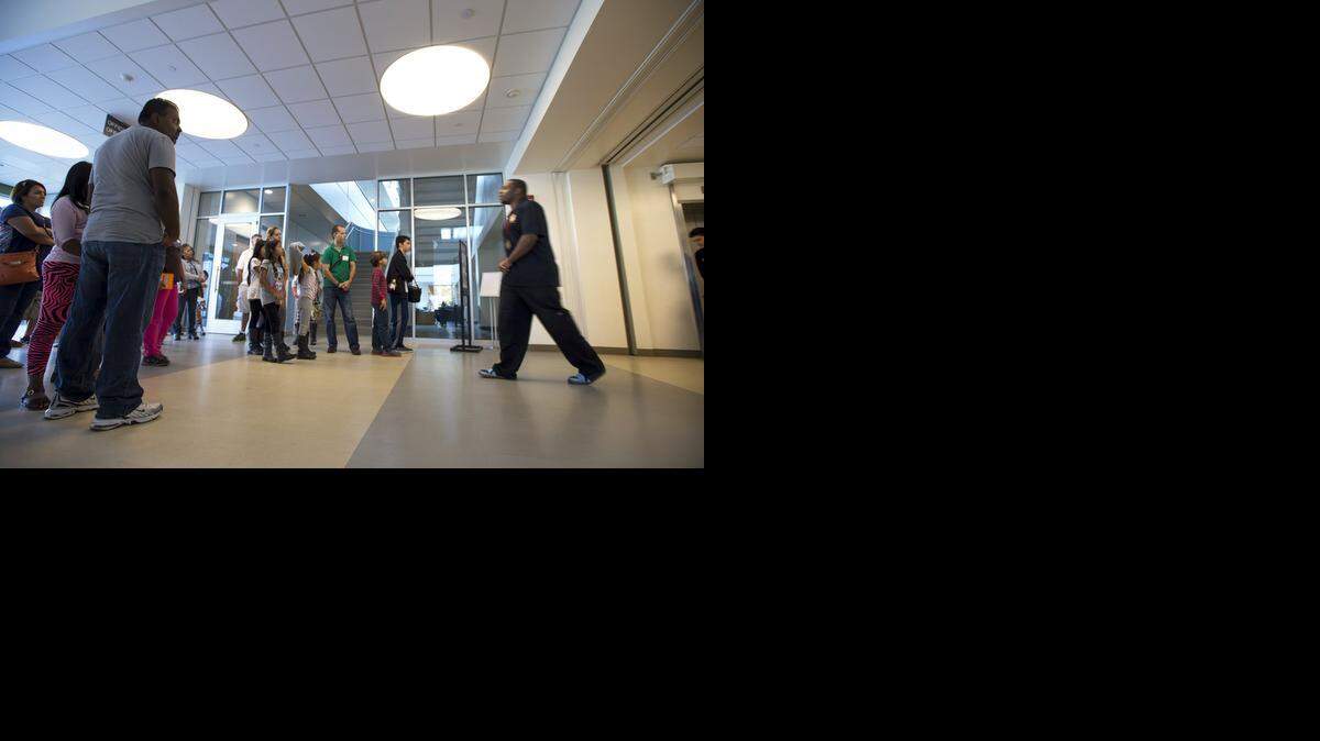 
CSUS university ambassador Terrance Sims gives Ceres students and their parents a look inside the Nora and Hashem Naraghi Hall of Science during a tour at California State University, Stanislaus, in Turlock on Saturday.
