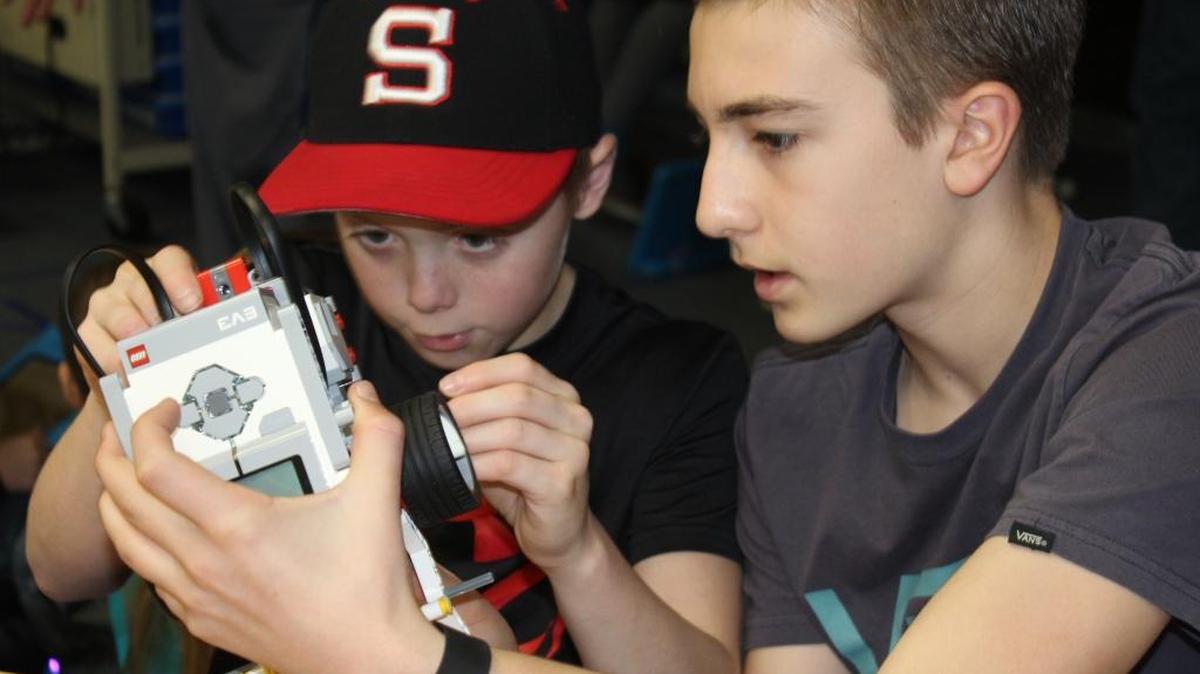 Seventh-graders Eli Elting, left, and Hayden Sundberg work on constructing programmable Lego robots at Knights Ferry School in Knights Ferry on Jan. 12. The small, rural school used grant funds to buy robotic materials and training for all its kindergarten through eighth-grade classes.
