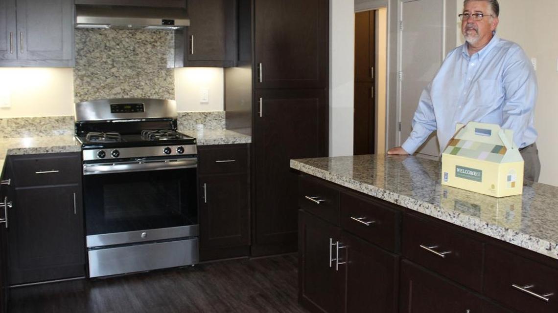 Phil Alfano, superintendent of the Patterson Unified School District, stands in the lower of two apartments in Patterson, Calif., owned by the school district that will be rented to now-commuting teachers. Both renters will pay market rate, $1,200 a month, but $500 of that will be saved toward a down payment on a home as part of a teacher retention program.