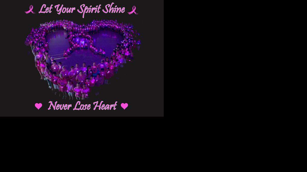 
 Students form a heart and a ribbon in Whitmore Charter School’s entry for the Ceres Fire Department’s annual breast cancer awareness photo contest. The school said the photo shoot took about 45 minutes from start to finish. 
