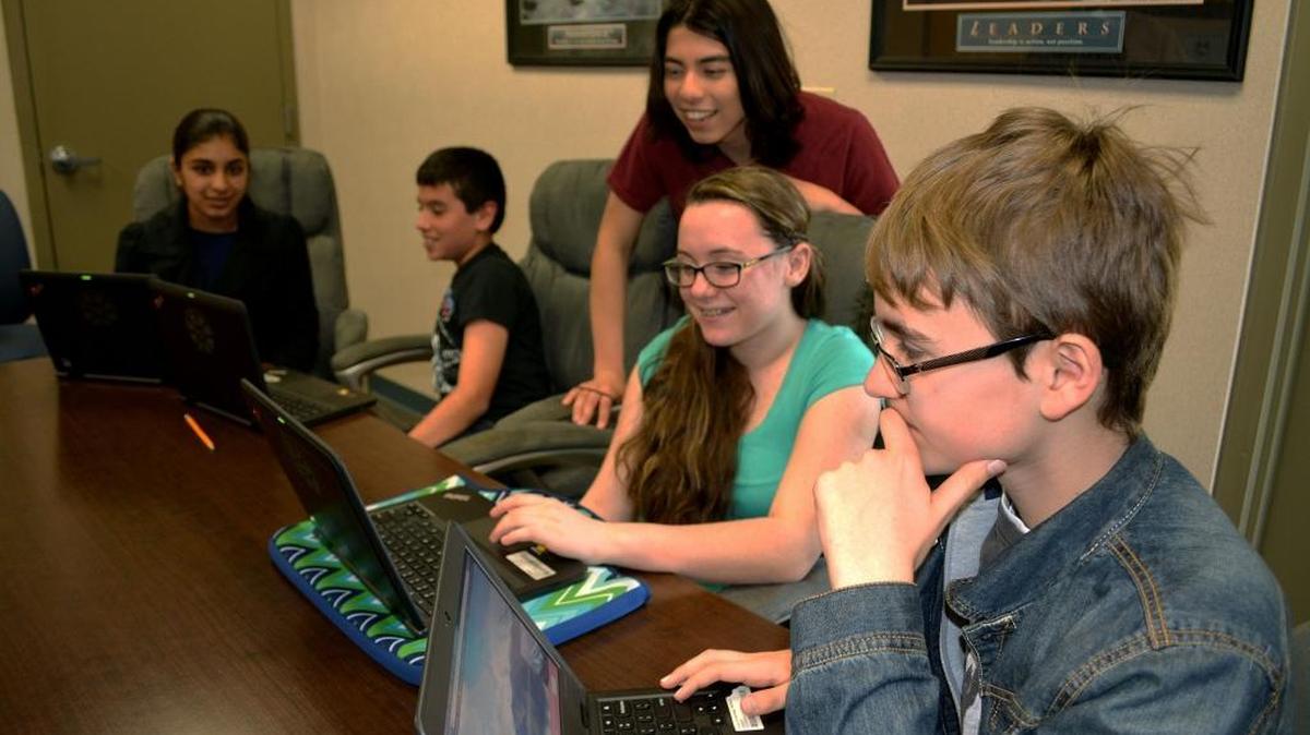 Creekside Middle School students, from right, Michael Trudrung, Kendra Rodgers, Nathaniel Mena, Alex Alvarez and Hamera Shabbir lead technology workshops for fellow students, showing them how to use their new Chromebooks to better advantage, in Patterson on Tuesday, March 1, 2016.