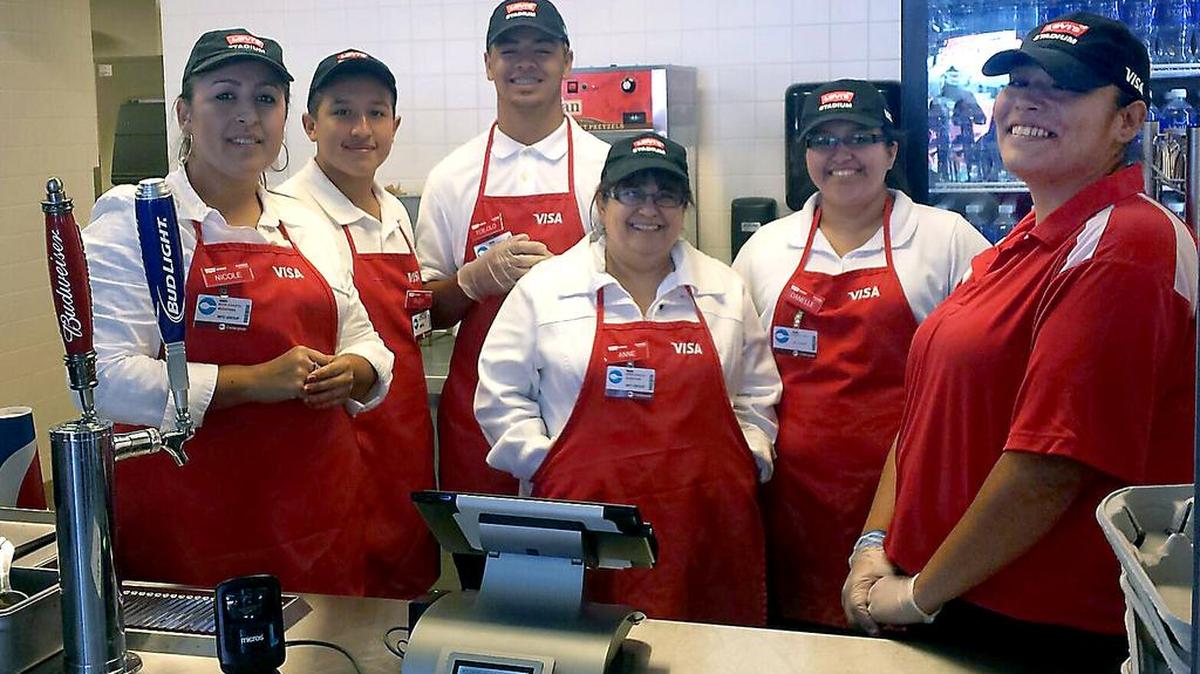 Davis High School boosters from Modesto work a Levi’s Stadium concession booth at a past game.