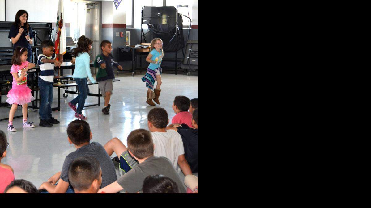 
Kindergartners step up for an impromptu dance after the video player refused to work at an assembly celebrating students at La Rosa Elementary in Ceres on Friday.
