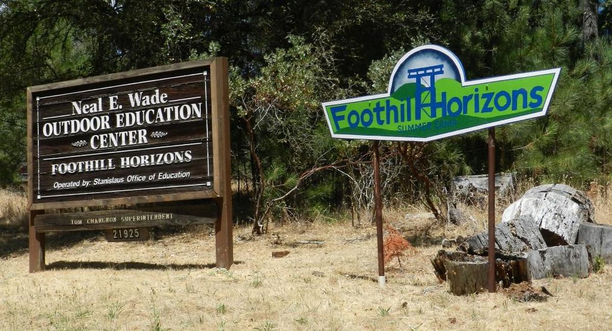 Signs announce the Foothill Horizons site on Lyons Bald Mountain Road outside Sonora.