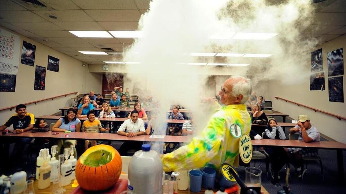 Steven Murov shows liquid nitrogen to an audience during Wild Planet Day at Modesto Junior College in 2012.