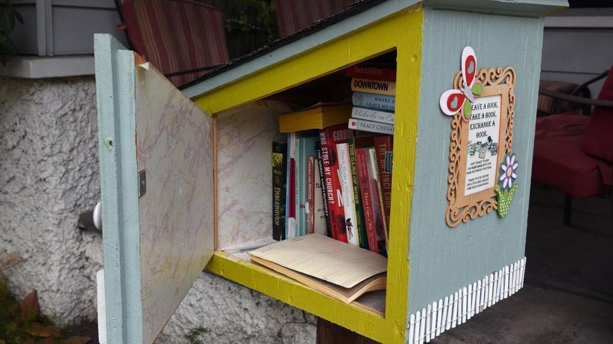 A Little Free Library is pictured Thursday morning on Hackberry Avenue in Modesto, Calif. The honor-system lending boxes are being promoted by Stanislaus READS, a countywide project to raise third-grade reading levels.