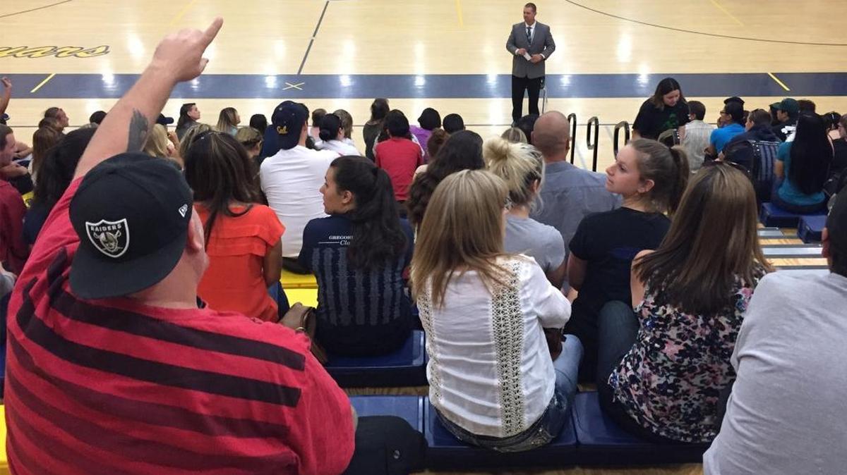 Principal Brad Goudeau talks to families about problems on the senior trip to Disneyland at Gregori High in Modesto, Calif., on May 16, 2014.