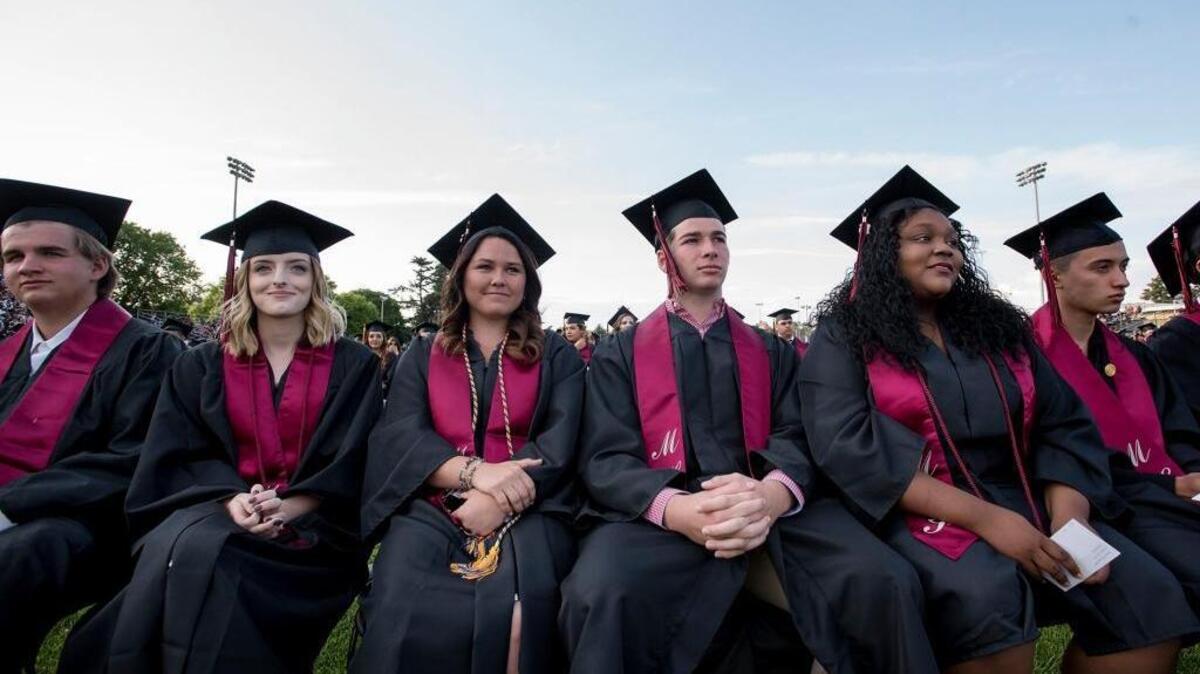 The Class of 2016 listens to the student speaker during the Modesto High School Commencement Ceremony at Modesto Junior College in Modesto, CA, on May, 24, 2016.