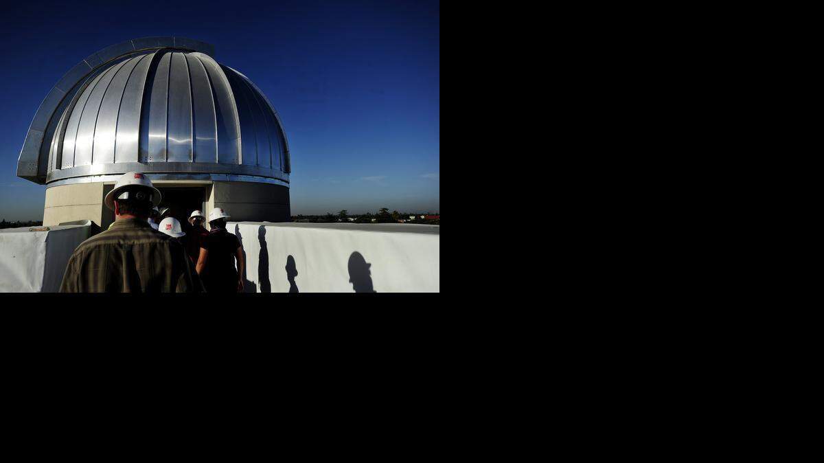 
A tour of the Science Community Center at Modesto Junior College takes in the rooftop telescope facility during construction in 2012 of the Science Community Center.
