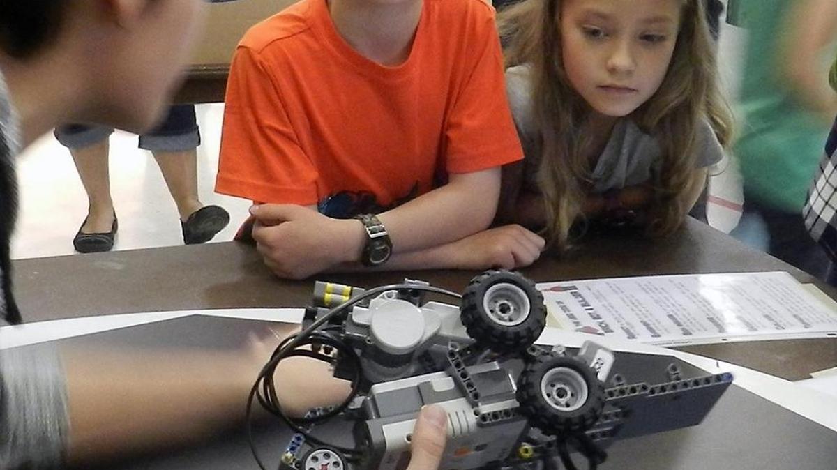 The Stanislaus County Office of Education offers a Maker Hoopla on May 20. Pictured here, Hickman students a teacher about robots at a May 2016 Hickman Charter School STEM Maker Faire.