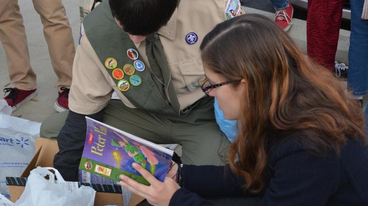 Claireen Chin helps unpack books to fill the Little Free Library installed at the Robertson Road Parent Education Center in south Modesto on Dec. 30, 2015, as an Eagle Scout project. Stanislaus READS! helps support similar efforts throughout the county.