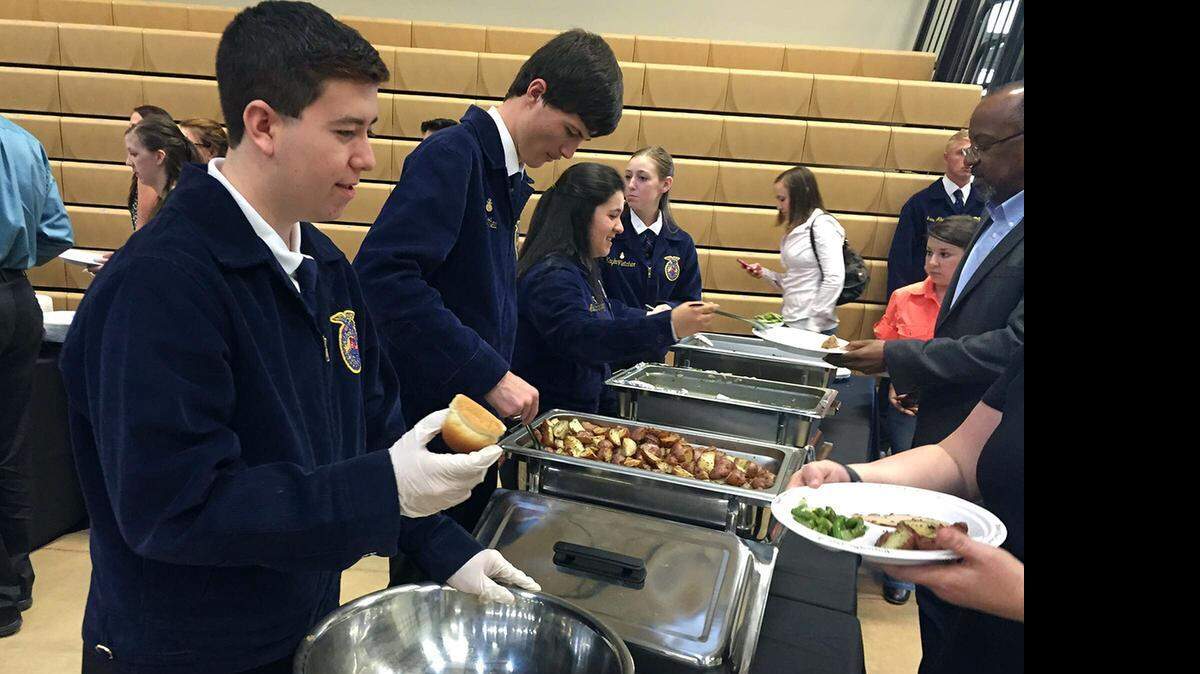 
Gabriel Casillas, left, and Matthew Barnett, who are FFA members at Enochs High School in Modesto, Calif., help serve at the Ag Aware luncheon on Thursday, April 16, 2015. It raised money for agricultural education at seven high schools in Modesto City Schools.
