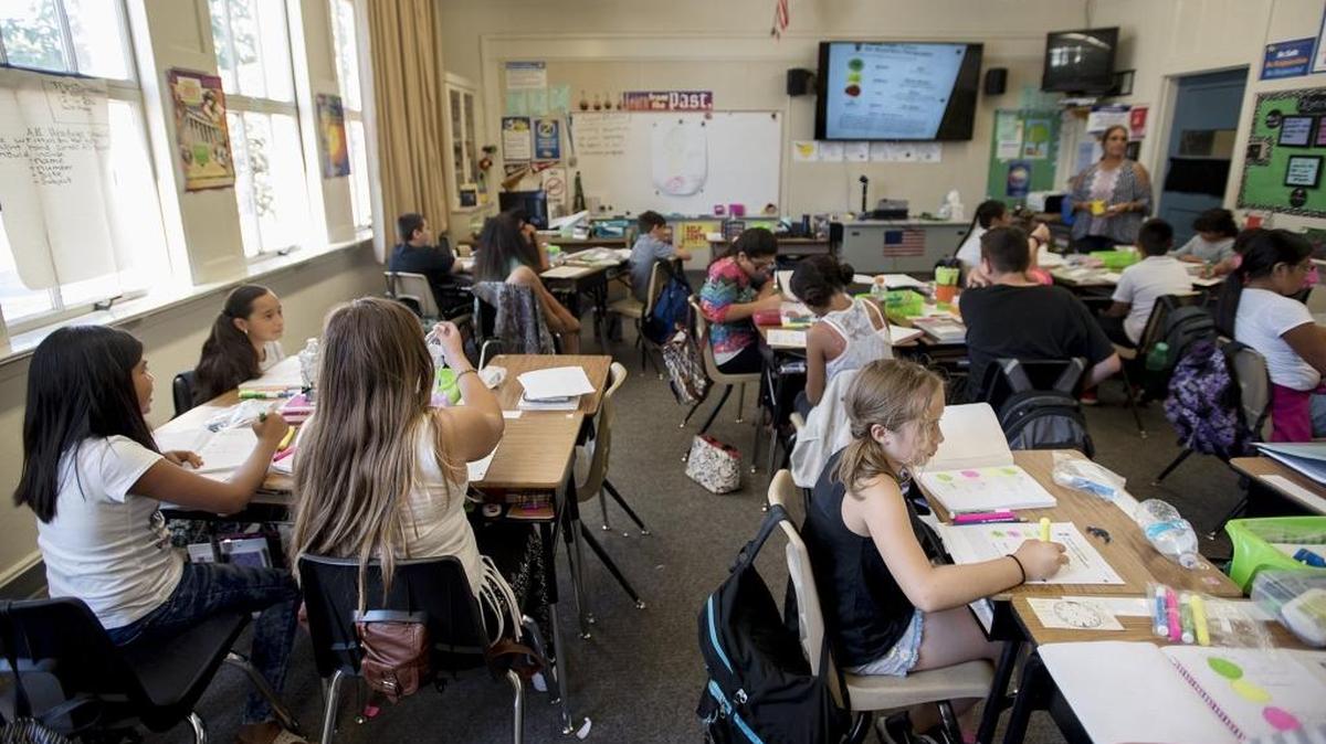 Sixth-grade students work on a writing exercise at Wilson Elementary School in Modesto on Wednesday, Aug. 24, 2016.