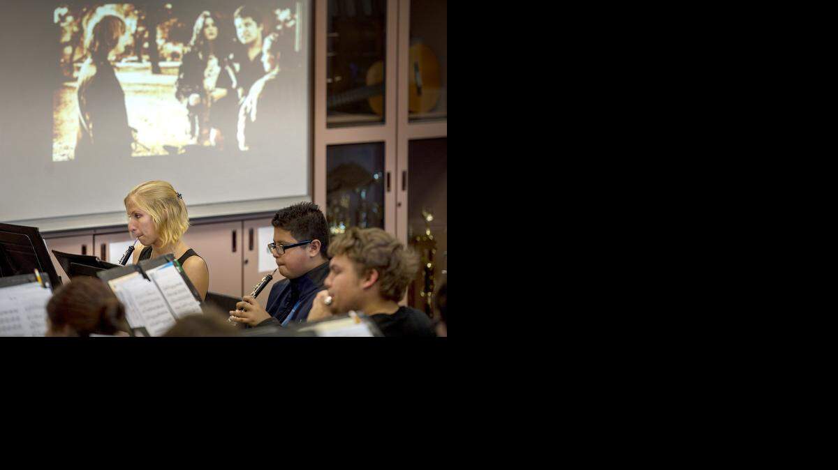 
Members of the Johansen High concert band, including Stephanie Seitzer, rehearse at the school Tuesday. Seitzer helped compose the score to the original silent movie they are preparing to perform as part of their 1920s concert to be held at the State Theatre on April 25.
