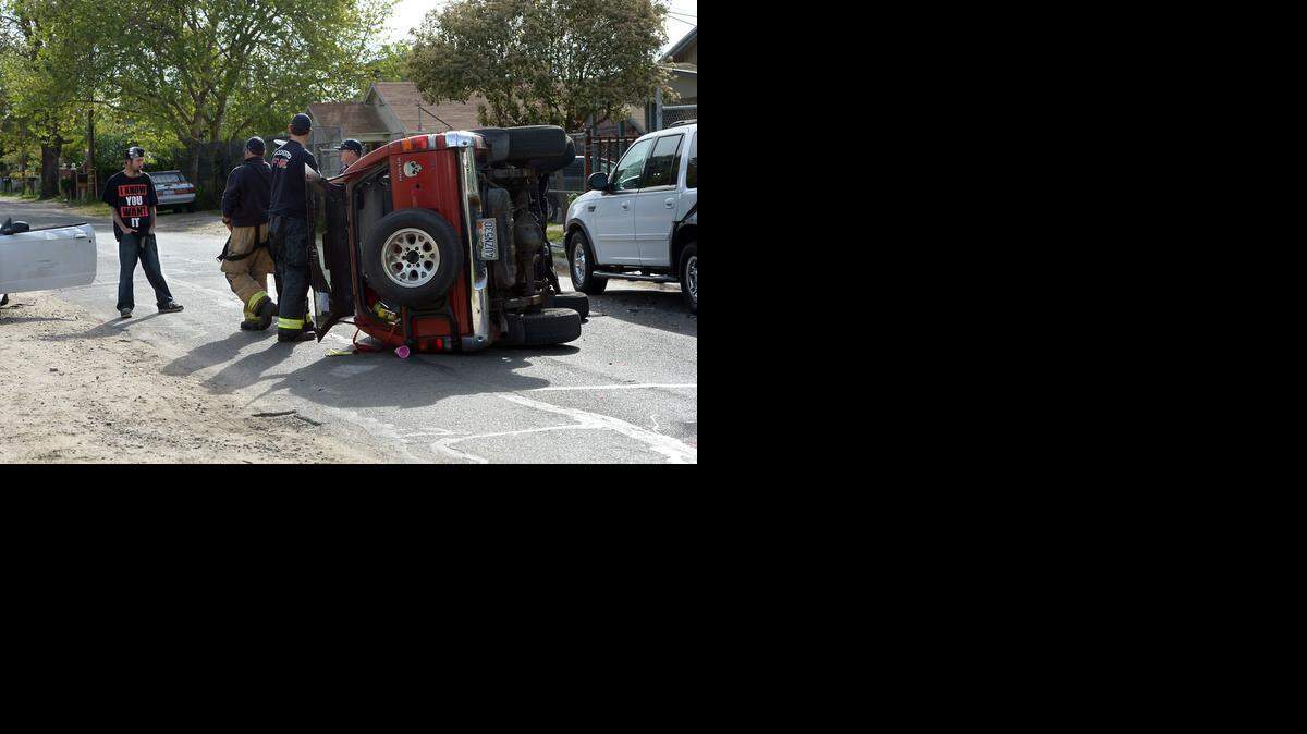 
Modesto police and fire crews are on scene at a vehicle rollover of a suspected stolen car that hit a parked car in Modesto, Calif. on Figaro Avenue Tuesday morning (03-24-15).
