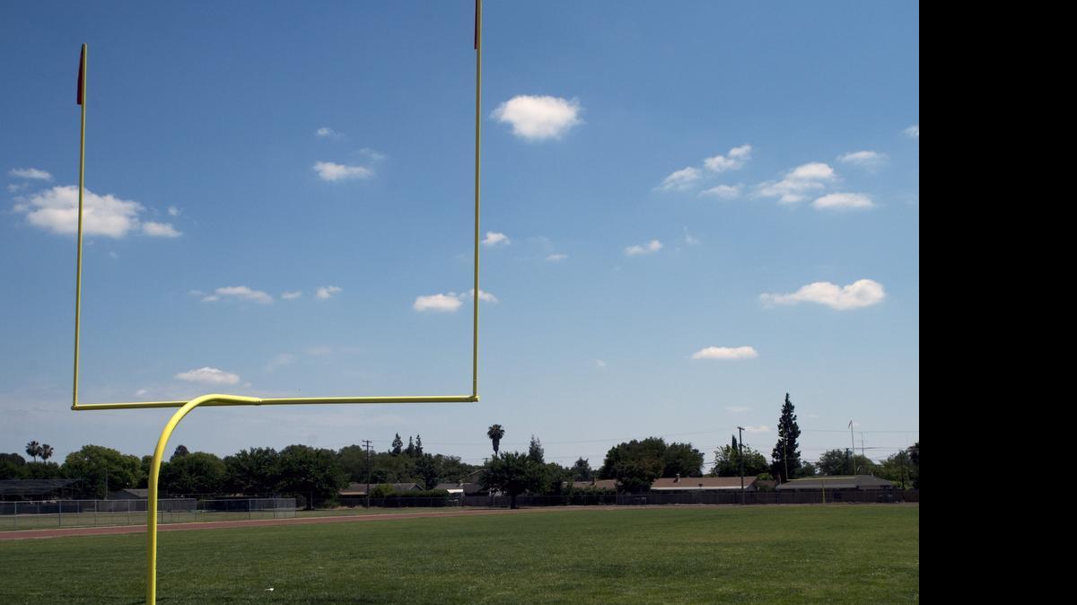 
New grass on the football field at Davis High School in Modesto getting watered Wednesdays through Saturdays to help get the grass established, according to a district official, although city drought restrictions allow watering only on Tuesdays and Saturdays. The district is not moving to reduce watering to comply with the restrictions.
