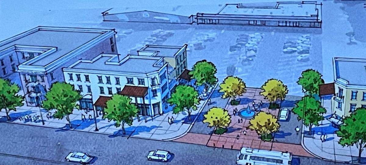 El primer plano muestra edificios de apartamentos de tres pisos previstos para el estacionamiento de varios negocios en las avenidas McHenry y Bowen en Modesto, California. El Concejo Municipal votó el 7 de noviembre de 2023 a favor de la rezonificación de cientos de terrenos de este tipo para usos mixtos.