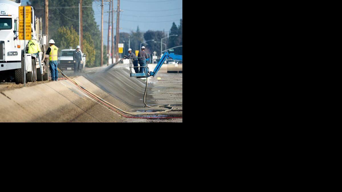 
Maintenance work is done on the Modesto Irrigation District canal along Briggsmore Avenue in Modesto on Jan. 13.
