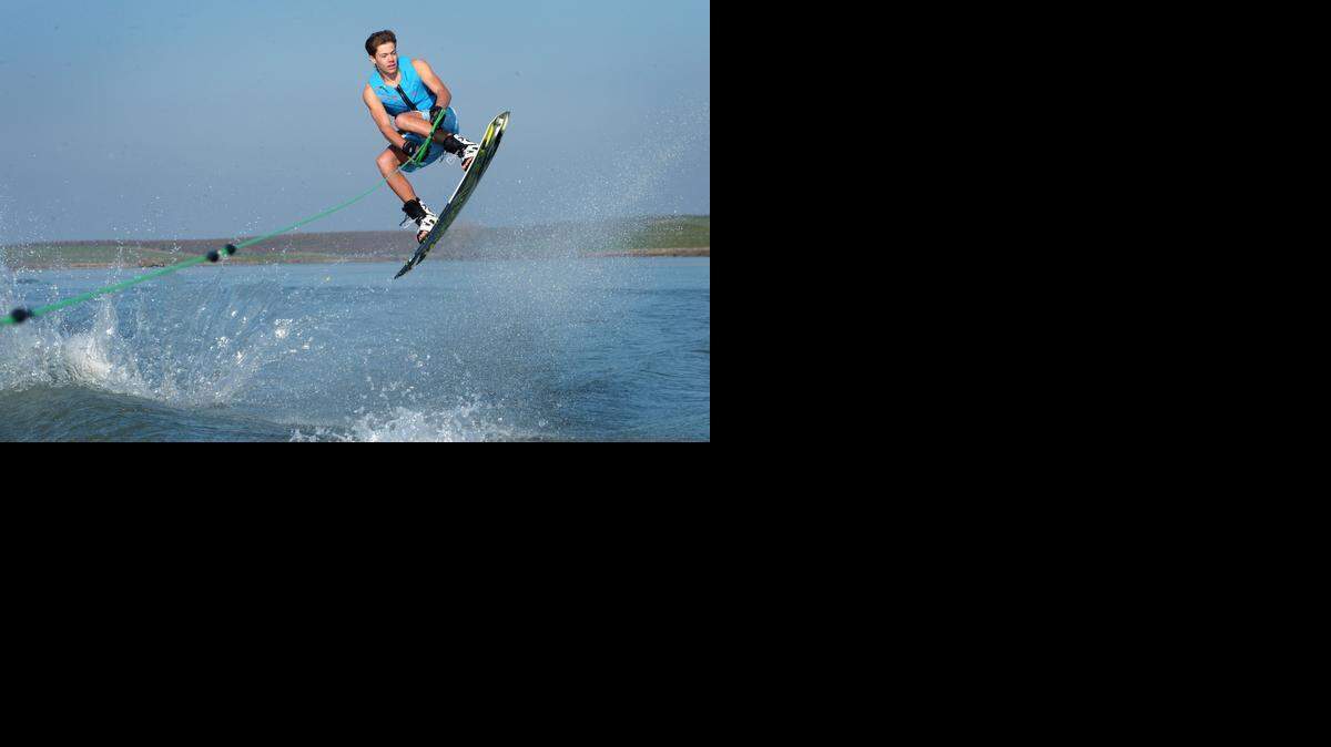 
First timer to the Polar Ski Day, Trevor Dixon, age 17, of Modesto gains air as he does a wakeboard trick at the 60th and last Polar Bear Ski by Mid-Valley Ski Club held at Modesto Reservoir, Jan. 1, 2015.
