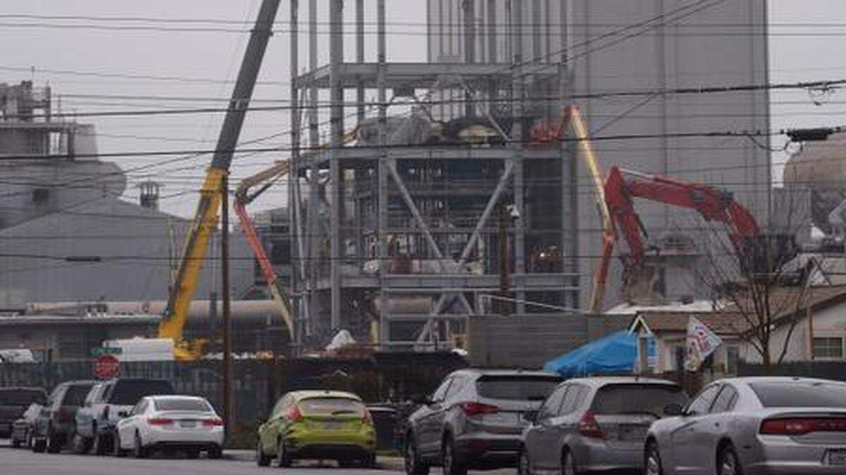 
A large crane and steel girders are alongside the Gallo Glass plant in January on South Santa Cruz Avenue.
