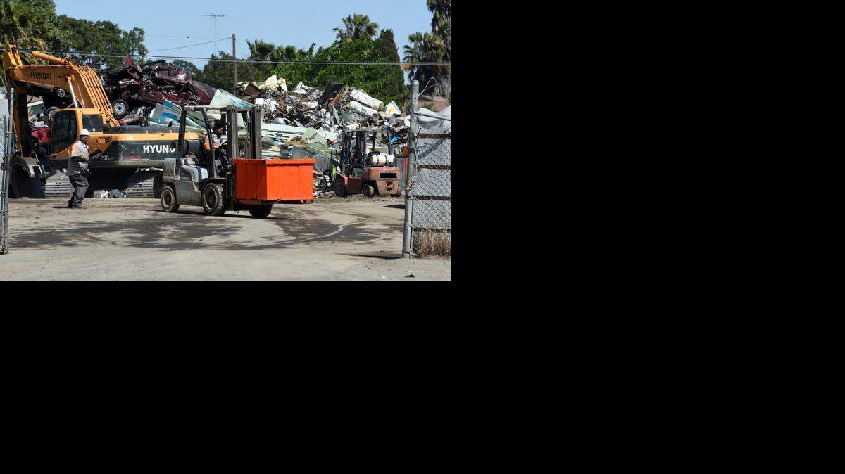 
Central Valley Recycling workers operate machinery at the business in Modesto. The company is seeking a land-use permit for its scrap metal recycling operation. 
