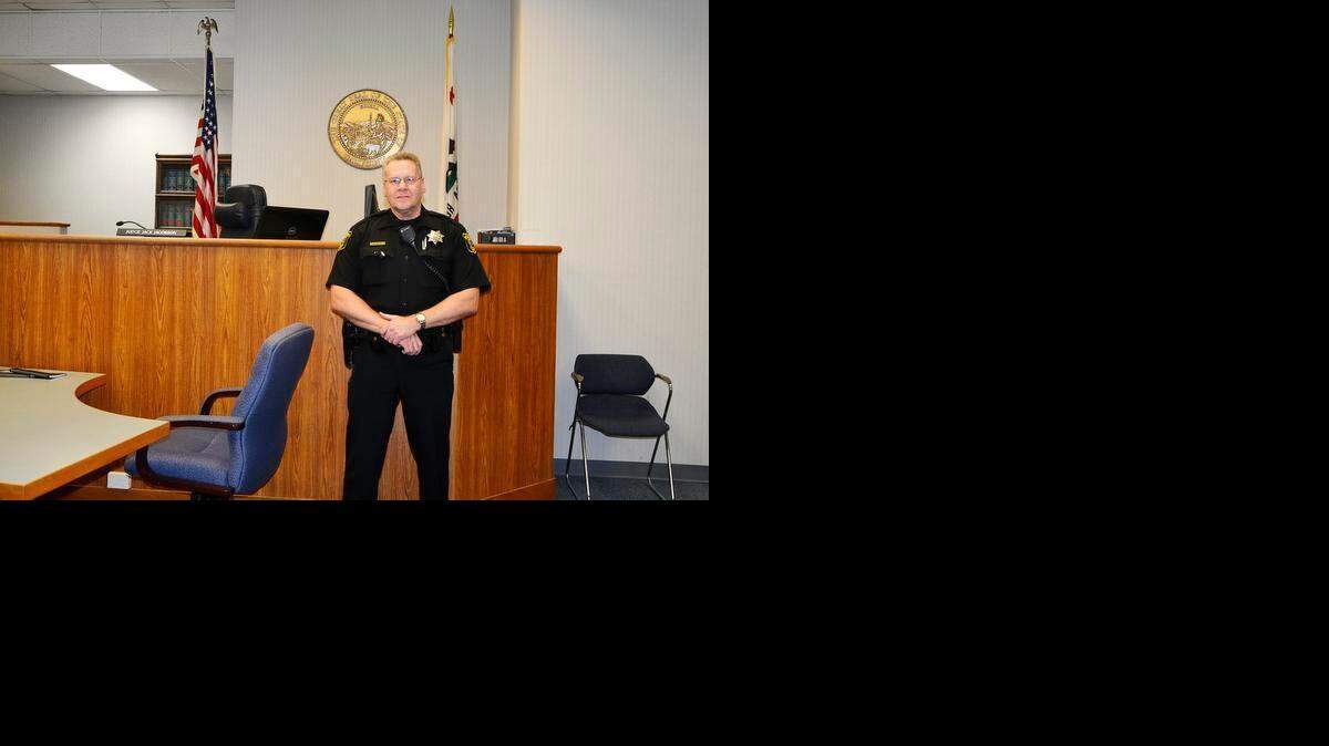 
Stanislaus County sheriff’s Deputy Richard Smith stands in a courtroom Thursday, the day before his retirement. Smith was the department’s last remaining deputy marshal from before the Marshal’s Office and Sheriff’s Department merged in 1992. 
