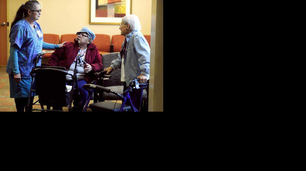 
Dora Robles, left, information and volunteer coordinator, assists Sutter Gould patients Carol Gress and Mathilda Owens, right, both of Modesto, on Wednesday in the lobby of the Coffee Road medical building. Sutter Gould is rated as the best physician group in California by Consumer Reports magazine.
