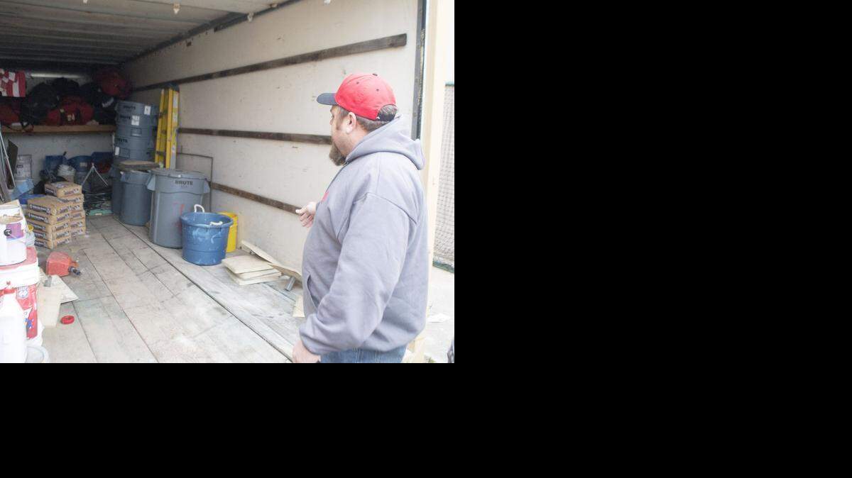 
John Cates looks in the storage shed where equipment and a utility vehicle were stolen from the Hart-Ransom Baseball Club at Hart-Ransom Elementary School in Modesto on Jan. 25.
