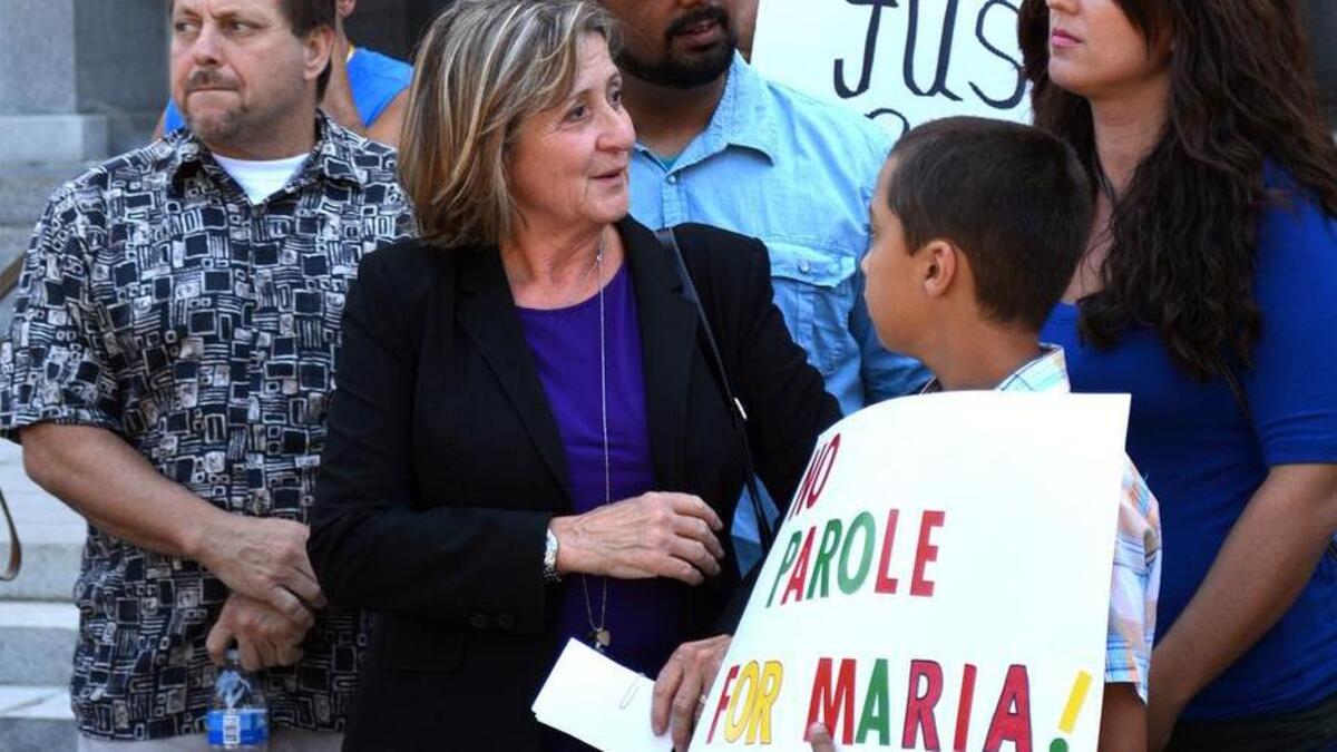 Sandy Ranzo-Howell and other family members are pictured Monday July 27, 2015, on the State Capitol steps to protest the recommended release of convicted murderer Jeffrey Maria.