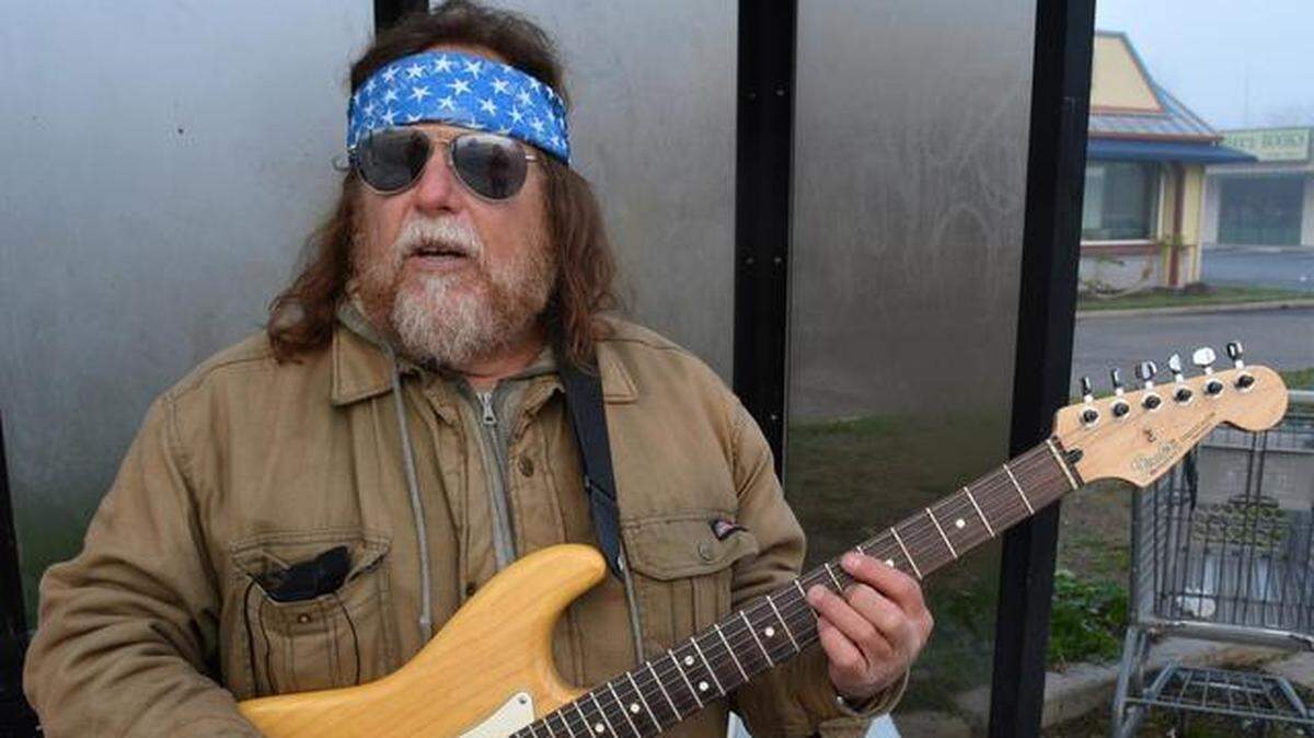 Kid Guitar was Modesto’s longest-reigning street musician, in a career spanning decades. Pictured with his Fender Stratocaster at a bus stop on north McHenry Avenue Jan. 30, 2015.