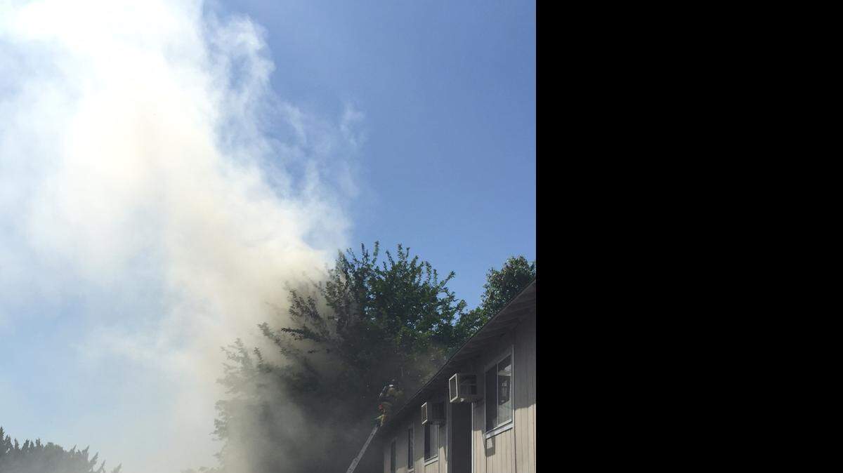 
Fire at the Sierra Glen Apartments on Coffee Road spread from a downstairs unit to one above it on Monday.
