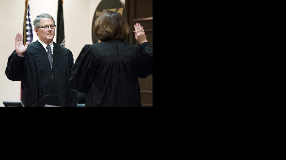 
Alan K. Cassidy is sworn in as a Superior Court judge of California for Stanislaus County by Judge Loretta Murphy Begen during an investiture ceremony at the Board of Supervisors chamber in Modesto on Friday. Cassidy has been assigned to the family law court.
