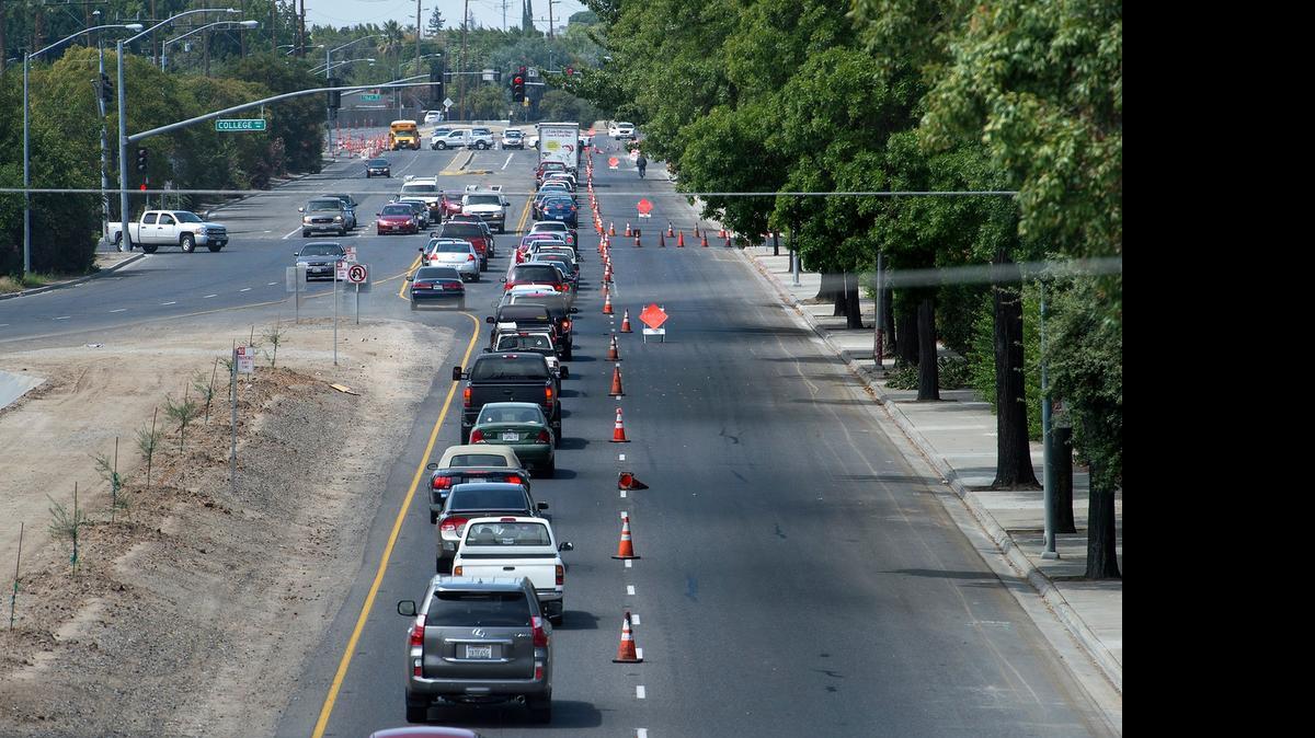 
Vehicles are funneled into one lane during the resurfacing of Briggsmore Avenue in August 2014.
