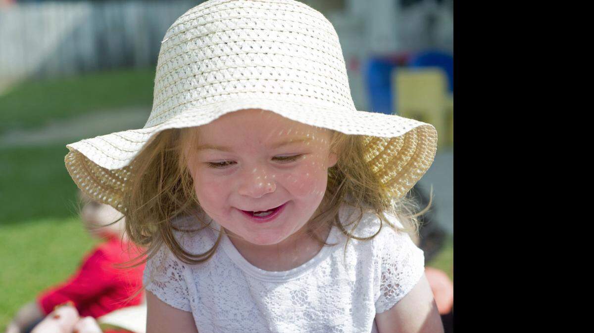 
Janessa Toenges laughs with joy as ladybugs are released during a celebration of Earth Day at Merryhill Preschool, where students released ladybugs into their gardens on Wednesday.
