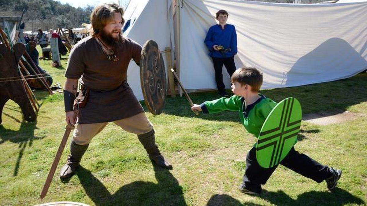 
Stockton resident Billy Lamphiear, left, and 4-year-old Modesto resident Luke Nomicos play-fight during the Sonora Celtic Fair on Friday. They are part of the Dark Boar Viking re-enacting group. The 29th annual Sonora Celtic Faire runs Friday through Sunday.
