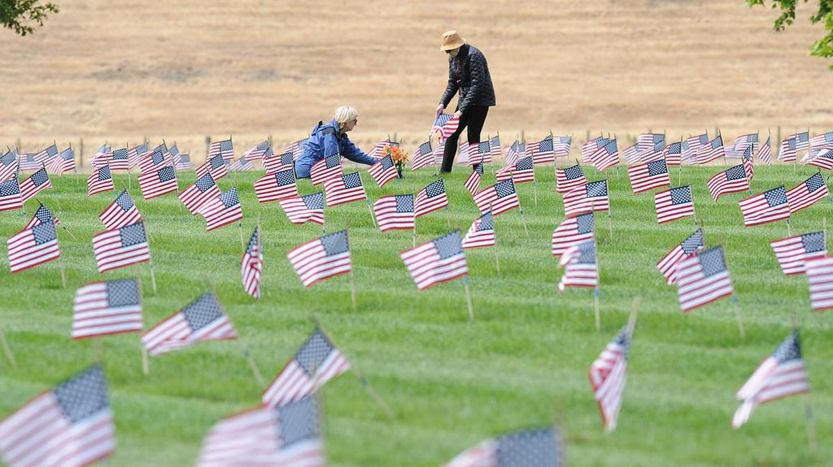 Following the Memorial Day ceremony Sunday morning, May 26, 2019 at the San Joaquin Valley National Cemetery in Santa Nella, family members took time to visit the graves of their loved ones.