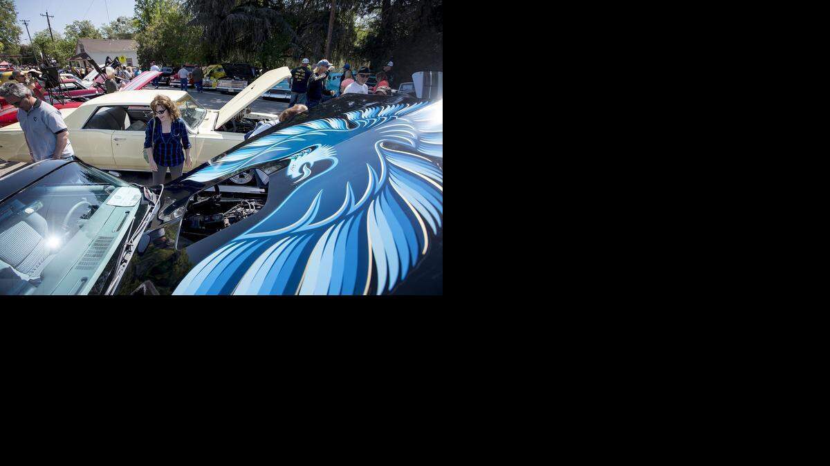 
Marie Enriquez of Salida looks at the 1979 Pontiac Trans Am owned by Oakdale resident Frank Yazembiak at the Knights Ferry Car Show in Knights Ferry on Saturday. The show was sponsored by the Knights Ferry Community Club.
