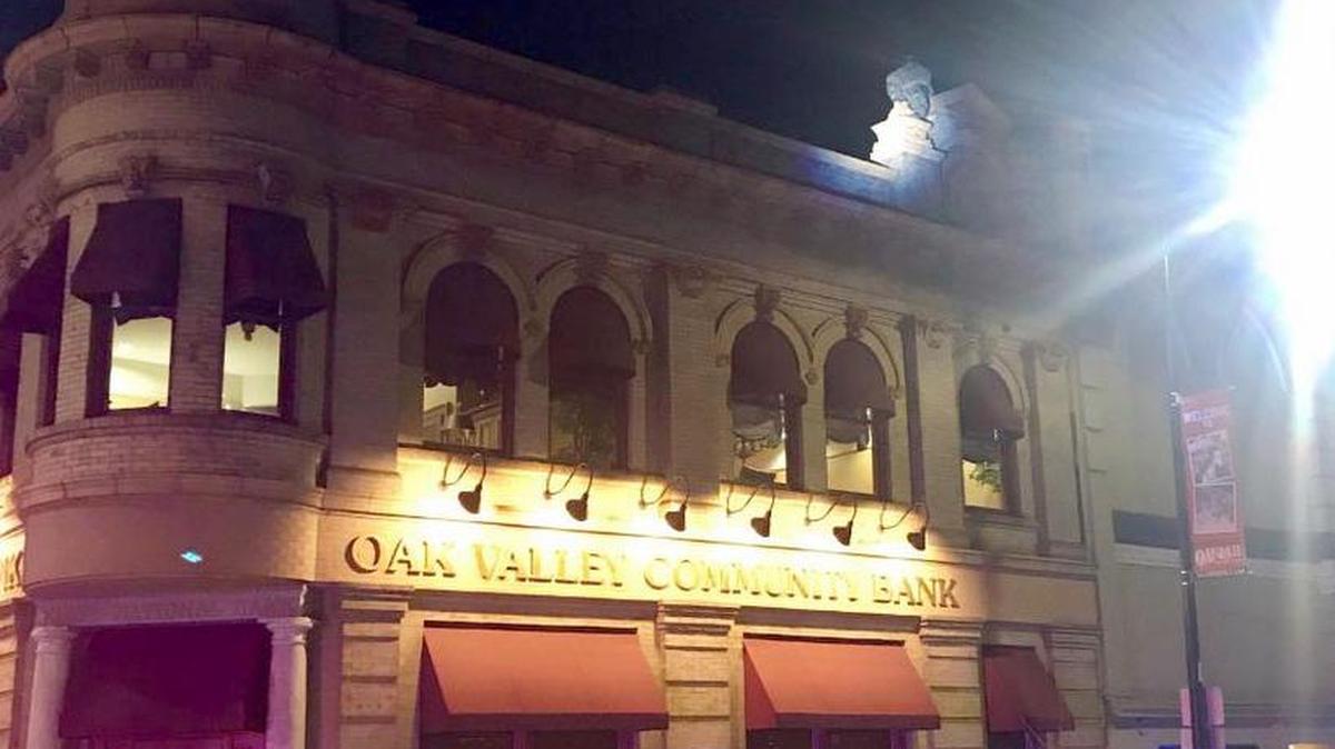 Photo shows the man, upper right on top of the building, who vandalized the historic clock tower building in Oakdale early Saturday, Dec. 8, 2017.