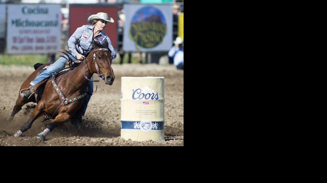 
Jandee Smart out of Red Bluff cuts around a barrel during a barrel racing competition at the Oakdale Rodeo Grounds on Thursday.
