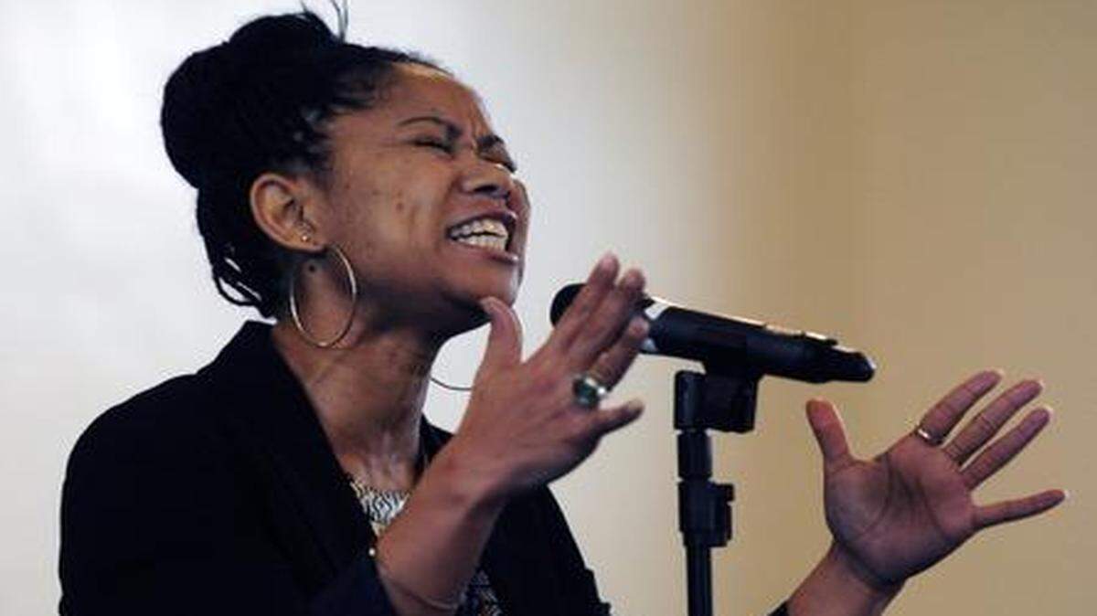 
Angela Drew performs a poetry selection Monday morning (01-19-15) during the 29th annual Dr. Martin Luther King Jr. Commemoration Ceremony at Christian Love Baptist Church in Modesto, CA.
