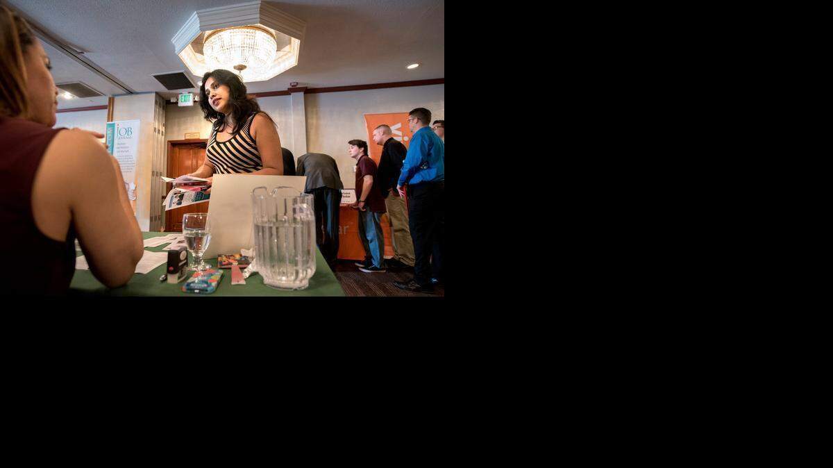 
Narinder Bahia of Ceres talks with Terry Gerbs of Delaware North during the HIREvent job fair at Clarion Inn in Modesto on Tuesday.
