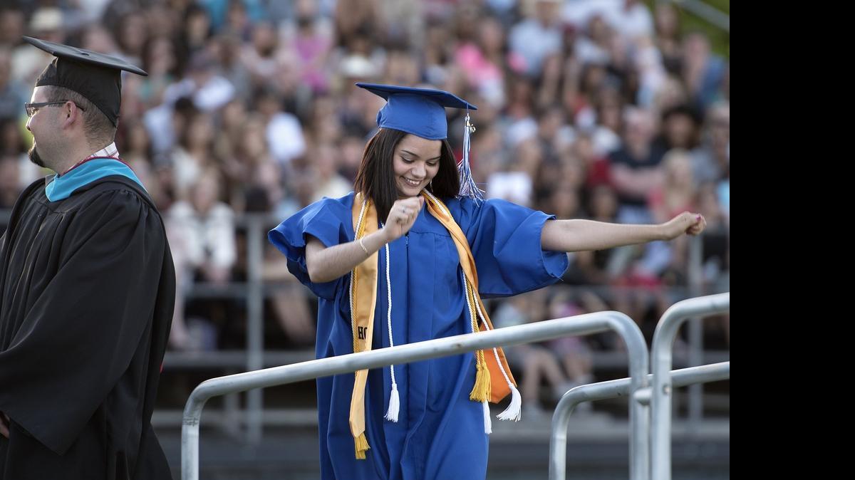 
Laura Valencia-Baez does a little dance as her name is read during commencement at Modesto Junior College on Friday. Valencia-Baez received an associate’s degree in business administration and will be continuing her education at California State University, Stanislaus.

