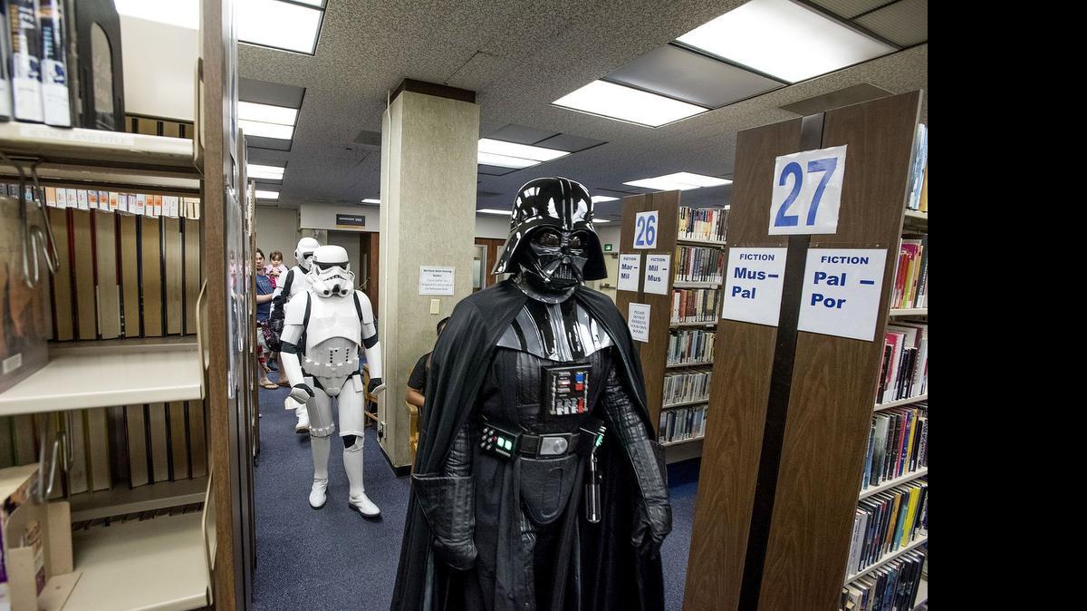 
Members of the Central California Garrison of the 501st Legion parade through the library as “Star Wars” characters before a screening of “Star Wars: Episode IV – A New Hope” at the Stanislaus County Library in Modesto on Friday.
