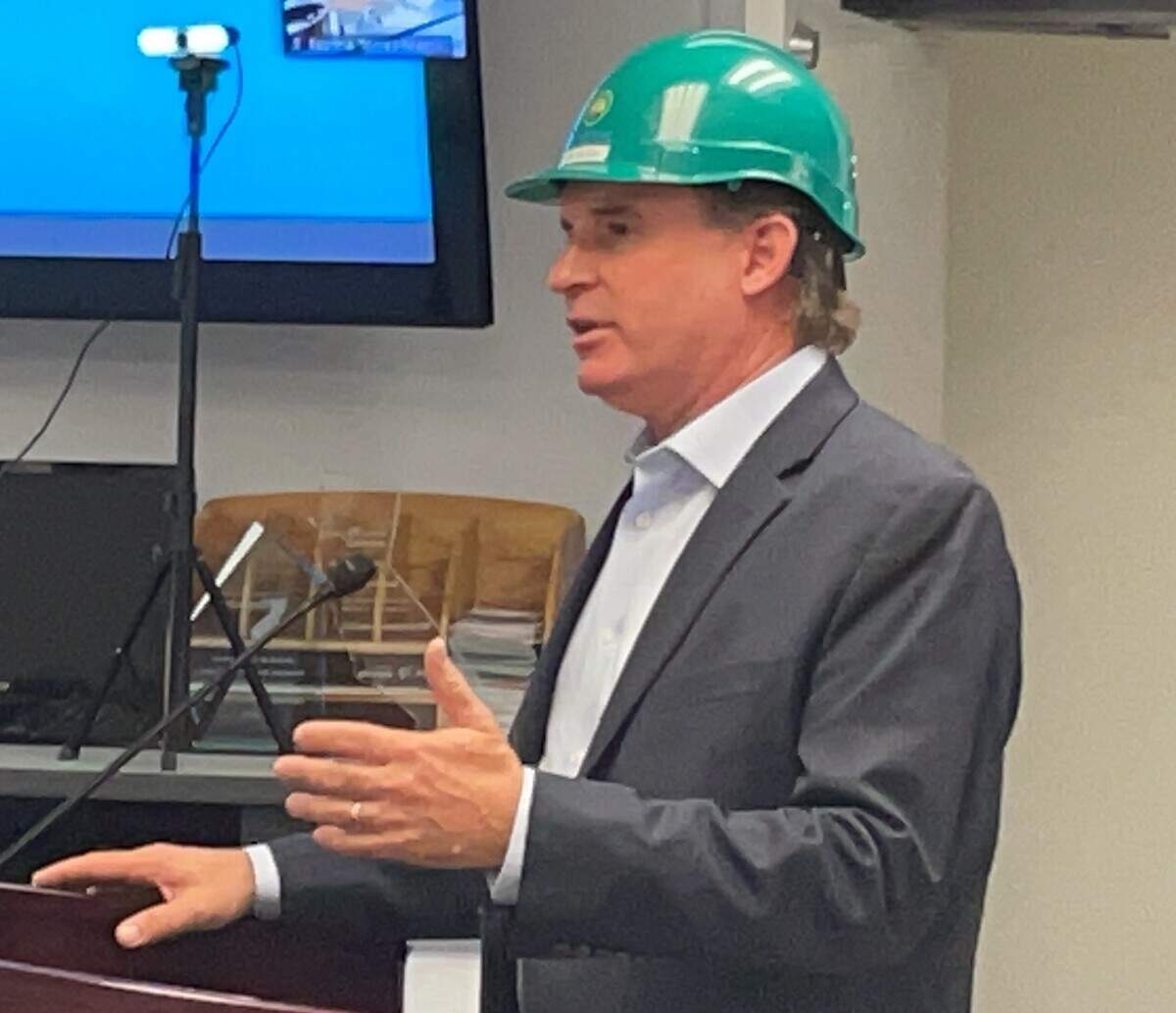 Eric McAfee of Aemetis Inc. donned a hardhat to celebrate approval of plans to produce ethanol from orchard waste in Riverbank CA on Aug. 24, 2021.