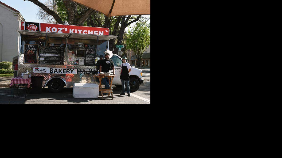 
Matt Kosmadakis and Sergio Palacios (right) are pictured with Koz’s Kitchen food truck at the Modesto Certified Farmers Market on 16th street Thursday morning. The truck is a new addition to the market this year. It serves American comfort food.
