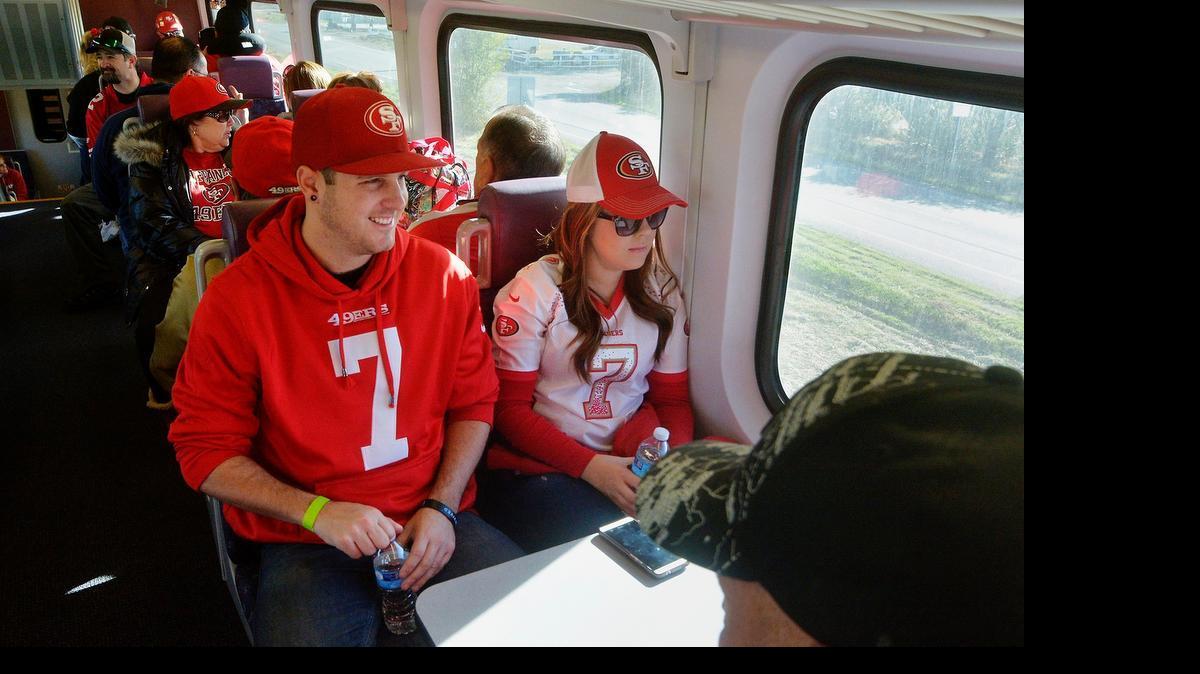 
Kris Ray and girlfriend Caitlin Riley, both from Ripon, enjoy the train ride for their first trip on the special train. Riders boarded the Altamont Corridor Express ACE train to attend the San Francisco 49er's game at Levi's Stadium on Nov. 23, 2014.
