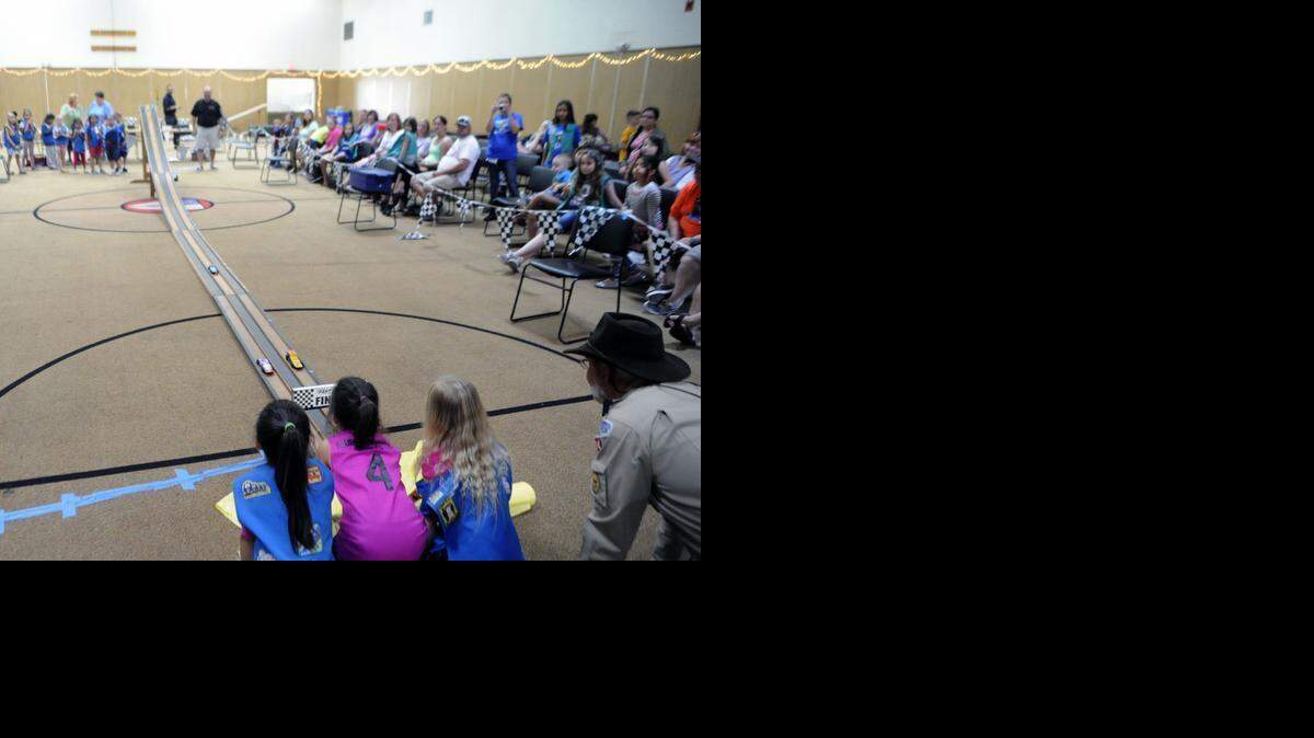 
Three cars race down the track during the Girl Scouts Powder Puff Pinewood Derby at St. Paul’s Episcopal Church Modesto on Saturday.
