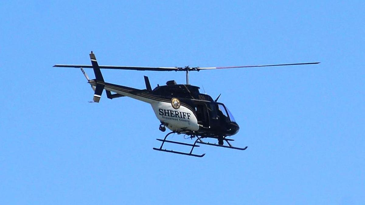 The Stanislaus County sheriff’s helicopter takes part in a search-and-rescue mission at Modesto Reservoir.